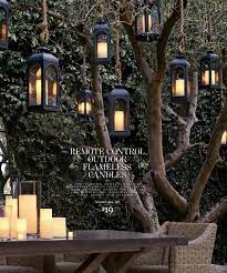 Lanterns Suspended From Trees Use Led Remote Control Candles Inside So They Light Instantly With The Fli Diy Outdoor Lighting Outdoor Lanterns Outdoor Trees