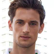 It's a hair style that is formed from back brushing ones hair and then using lots of hair spray to make it very poofy. Men S Brushed Back Hairstyles A Gallery