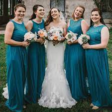 Jordan S Bridesmaids In Beautiful Oasis Blue Illusion Neckline Gowns From David S Bri Davids Bridal Bridesmaid Dresses Brides Maid Dresses Blue Magenta Wedding