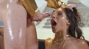 Abella Danger covered with gold and oil gets ass fucked to squirt