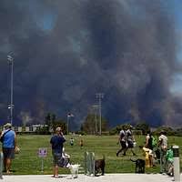 Fire rescue personnel evacuate family members from base housing at Naval  Support Activity Mid-South.