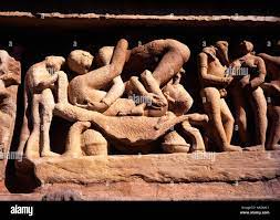 India Madhya Pradesh Khajuraho erotic orgy scene carvings on Lakshmana  Temple Stock Photo - Alamy