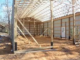 Anchor roof trusses to the beams using metal plates. How One Man Built His Pole Barn House Building A Pole Barn Pole Barn House Plans Pole House