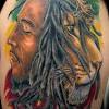 Dark ink bob marley portrait tattoo on forearm. 1