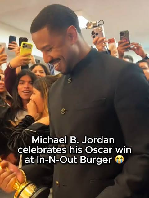 Michael B. Jordan posing with fans and Oscar at In-N-Out