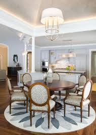 Combine this with a sideboard in a warm color for your little bit of france. Gray White Dining Room With Floral Accents Eye Catching Chairs Round Table Hgtv