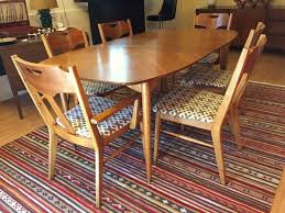 As welcome an addition as it is a necessary one. Vintage Mid Century Pecan Dining Set By Hooker Epoch