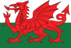The flag incorporates the red dragon of cadwaladr, king of gwynedd, along with the tudor colors of green and white. Y Ddraig Goch Wales Flag Welsh Flag Flag