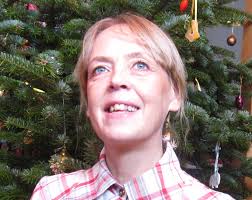 What is the least windy and warmest side of Crete?