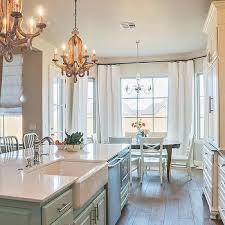 Antique white and espresso dark cabinets juxtaposed to the marble tops create together a fantastic refined appeal. Agreeable Gray Design Ideas