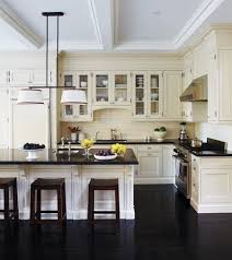 Dark Floors In The Kitchen Give Depth To The Cream Cabinets Love The Color Scheme Good Compromise When Home Kitchens Kitchen Design Interior Design Kitchen