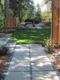 Square Concrete Stepping Stones Trimmed With Pebbles Extend Patio Courtyard Landscaping Pathway Landscaping Walkway Landscaping