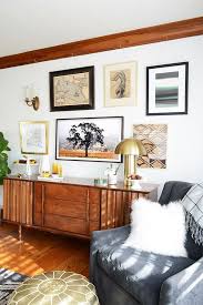 See how #theframe fits in perfectly with your gallery wall! This Post Was Created In Partnership With Samsung Christmas Came Early To The Mcconnel House A Gallery Wall Living Room Living Room Tv Wall Condo Living Room