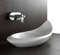 We are very selective when it comes to the brands of vanities we carry, picking only the finest models from the best manufacturers. Above Counter Designer Basin Komo Of White Marble Natural Stone Basin Stone Basin Modern Vanity
