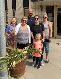 Maybe you would like to learn more about one of these? Business Members Farmers And Citizens In Community Come Together For Fall Downtown Beautification Project