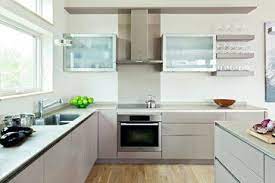 Cabinets are set off with sleek stainless steel handles. 29 Glass Door Showcases Ideas Glass Cabinet Doors Glass Door Open Storage