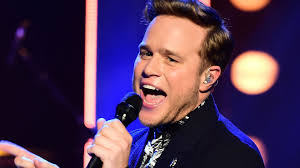 Pop star Olly Murs brings the X-Factor to Fakenham with surprise appearance  at town football club