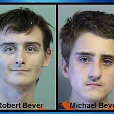 Arraignment delayed for brothers charged in killings of 5