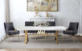 A glam chandelier illuminates a black french dining table complemented with white french dining chairs. Adeline Dining Table Tov Furniture