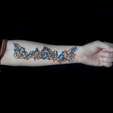 Letter a tattoo design with crown; Graffiti Style Colored Forearm Tattoo Of Small Lettering Tattooimages Biz