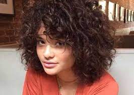 One of the sassiest ways to wear your naturally curly hair is in a short, stacked bob with lots of loops and volume on top and in the back. Pin On Short And Curly Hairstyles 2018