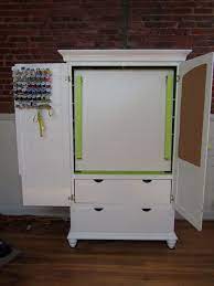 Fold up craft table and storage shelves. Img 0868 Jpg Craft Armoire Craft Room Storage Craft Room Office