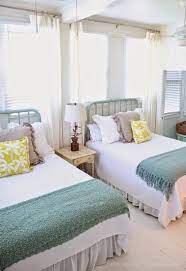 Bright And Beach Themed Twin Beds In A Guest Room Decoist Coastal Bedroom Decorating Guest Bedrooms Coastal Bedrooms
