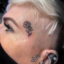 Image result for quirky pylon forehead tattoo
