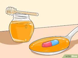 ابتلاع حبة دواء Wikihow