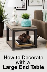 The end table in this room serves a very simple purpose; How To Decorate With A Large End Table Overstock Com