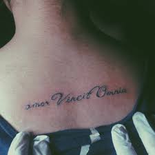 Amor vincit omnia side tattoo; Upper Back Tattoo Saying Amor Vincit Omnia On Helen