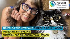 Truffles the Kitty and Danielle Crull, ABOM, Win Champion for Children's  Vision Award