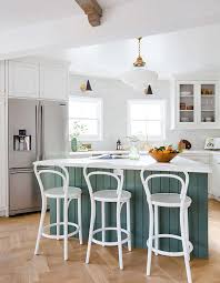 In this kitchen, the cool green island offsets the warm tones on the handmade backsplash tiles. Bored Of White Kitchens Discover The Cabinet Color Trending Now House Home