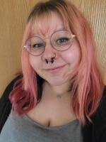 Under the red suit, a Bloomington-Normal Santa's helper has a giving heart 