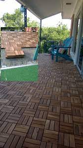 Covered The Many Layers Of Astroturf With Ikea Acacia Deck Tiles Outdoor Flooring Patio Balcony Ideas Outdoor