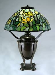 The chrome metal base gives good stability. Tiffany Studios 16 Tulip Lamp 16 Diameter Tulip Pretty Yellow Tulips That Vary From Lemon Yellow Striate Tiffany Lamps Art Glass Lamp Tiffany Style Lamp