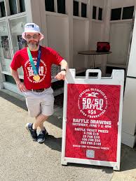 Matt and Dylan Heim receiving a Holiday thank you from East Greenbush  Police Department for their donation to Special Olympics NY at a recent  'Cops