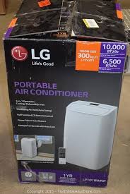 Lg portable air conditioner in a living room next to a couch. Lg Air Conditioner Portable Home Depot