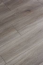 About A Month Ago My Sister And Her Husband Who Live Right Around The Corner From Us Brown Laminate Flooring Laminate Flooring In Kitchen Laminate Flooring