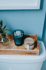 Below, eight ideas for what to do with that weird space above your toilet, from storage to décor. How To Style A Back Of Toilet Tray Decor Hint