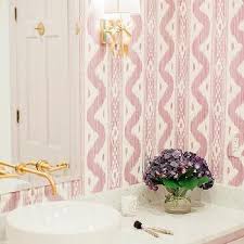 Nestled within this metal flower, a single candelabra lends spaces an even layer of illumination. Kate Spade Sconce Design Ideas