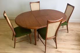 Furnish me vintage carries one of the florida's largest teak furniture collections including beds, tables, chairs, and desks by mid century modern designers. Round Teak Dining Table With 4 Chairs Midcentury Modern Dining Room Sets Sweet Modern Akron Oh