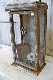 Classy contemporary glass doors create an understated feature in any room. Ornate Display Box Showcase Glass Faux Metal Rusty Finish French Farmhouse Observation Piece With Door Anita Spero Display Display Boxes Bottle Display
