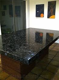 Dining tables, side tables, console tables and coffee tables with granite tops add chic and style to granite bathroom and kitchen countertops are not only stylish, but also durable and practical. Ukraine Volga Blue Dinning Table Tops Granite Dining Table Blue Granite Granite Table