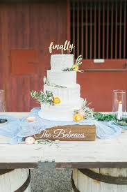 Peach Ranunculus And Olive Branch Embellishments On The Cake By Layers Of Lovely Photography By J Anne Photograph Peach Wedding Wedding Rustic Garden Wedding