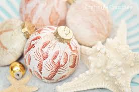 Unfortunately these fun ornaments are not on their site this year. Coastal Mod Podge Diy Christmas Ornaments