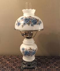 Monochromatic, floral, ornate with bronze ormolu, ornate oriental lamps. Vintage White Milk Glass Table Hurricane Lamp Floral Blue Roses Ruffle Top 22 Antique Oil Lamps Vintage Lamps Antique Lamps
