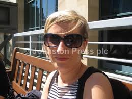 39665419-Katie Haslam selecting cut flowers for a customer.