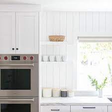 Shiplap isn't limited to beauty without function. Vertical Shiplap Kitchen Backsplash Design Ideas