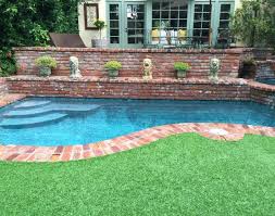 Faux Turf Artificial Grass A Guide My Soulful Home Backyard Pool Designs Backyard Pool Pool Landscaping